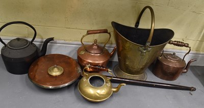 Lot 465 - Two copper kettles, a cast iron kettle, a...