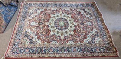 Lot 187 - A red ground Shiraz carpet, with central...