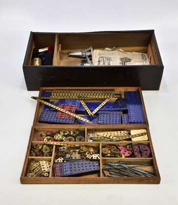 Lot 292 - MECCANO; a wooden box of assorted parts and...