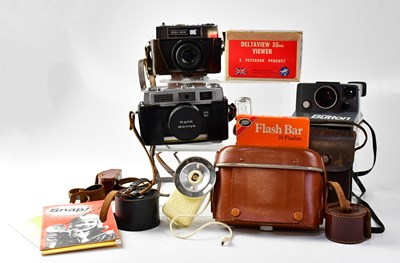 Lot 527 - A group of cameras and accessories, to include...