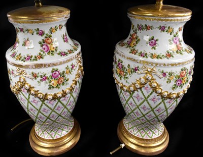 Lot 575 - A pair of Sevres style table lamps with raised...