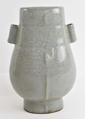 Lot 587 - A Chinese celadon glazed Guan type vase,...