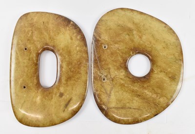 Lot 584 - Two Chinese hardstone bi discs, 23.5cm and 23cm.