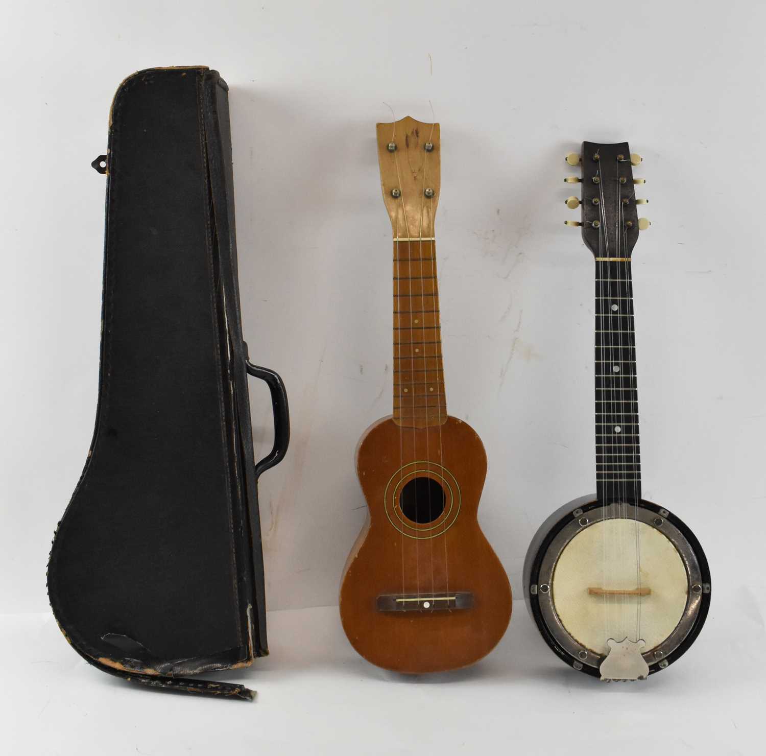 Lot 428 A modern Japanese ukulele and a cased banjo.