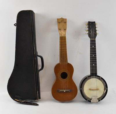 Lot 428 - A modern Japanese ukulele and a cased banjo.