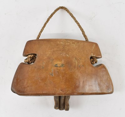 Lot 449 - An African wooden cow bell, width 25cm.