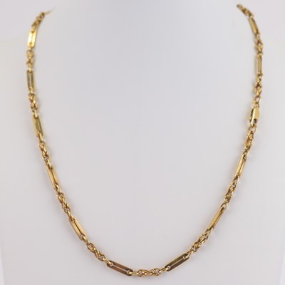 Lot 896 - A 9ct rose gold chain and bar necklace with...