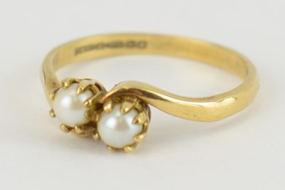 Lot 960 - A 9ct gold seed pearl crossover ring, size Q,...