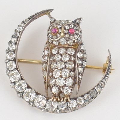 Lot 873 - A yellow gold owl and crescent diamond brooch...