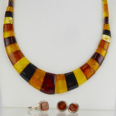 Lot 937 - A collection of modern amber and silver...