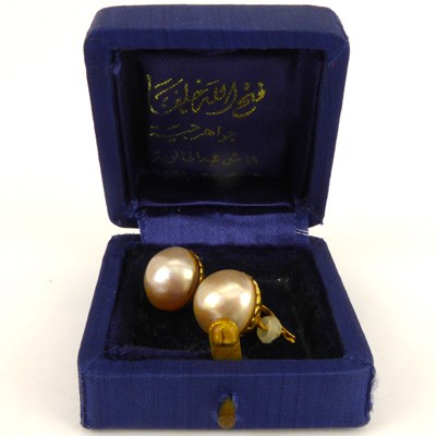 Lot 906 - A pair of Mabe pearl earrings on yellow metal...