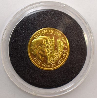 Lot 994 - ROYAL MINT; two Guernsey five pound gold coins,...