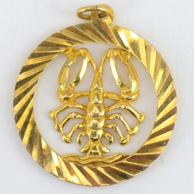 Lot 979 - A 9ct gold Scorpio circular pendant, diameter...