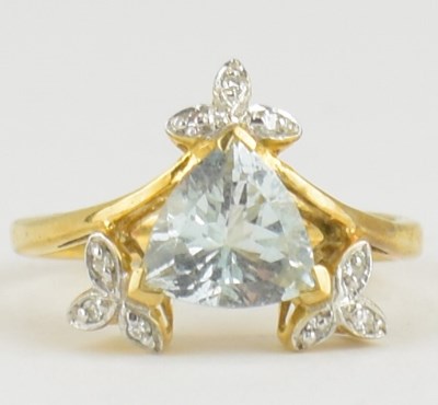 Lot 973 - A 9ct aquamarine and diamond yellow gold ring,...