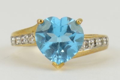 Lot 945 - A 9ct gold Swiss Blue topaz and diamond gold...