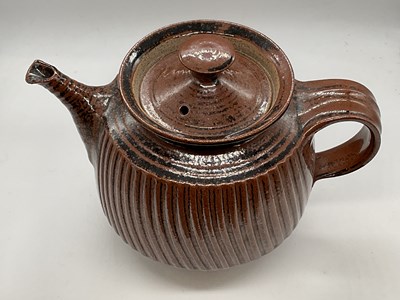 Lot 238 - A studio pottery teapot with footed base,...