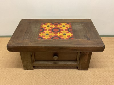 Lot 715 - A coffee table with drawer and tile top,...