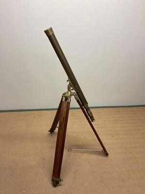 Lot 42 - A reproduction brass telescope on tripod stand,...