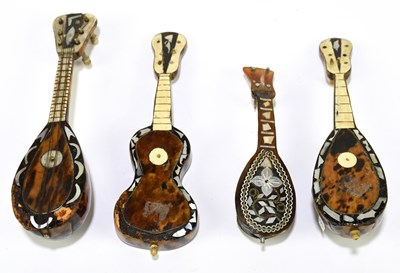 Lot 85 - A collection of four tortoiseshell veneered...