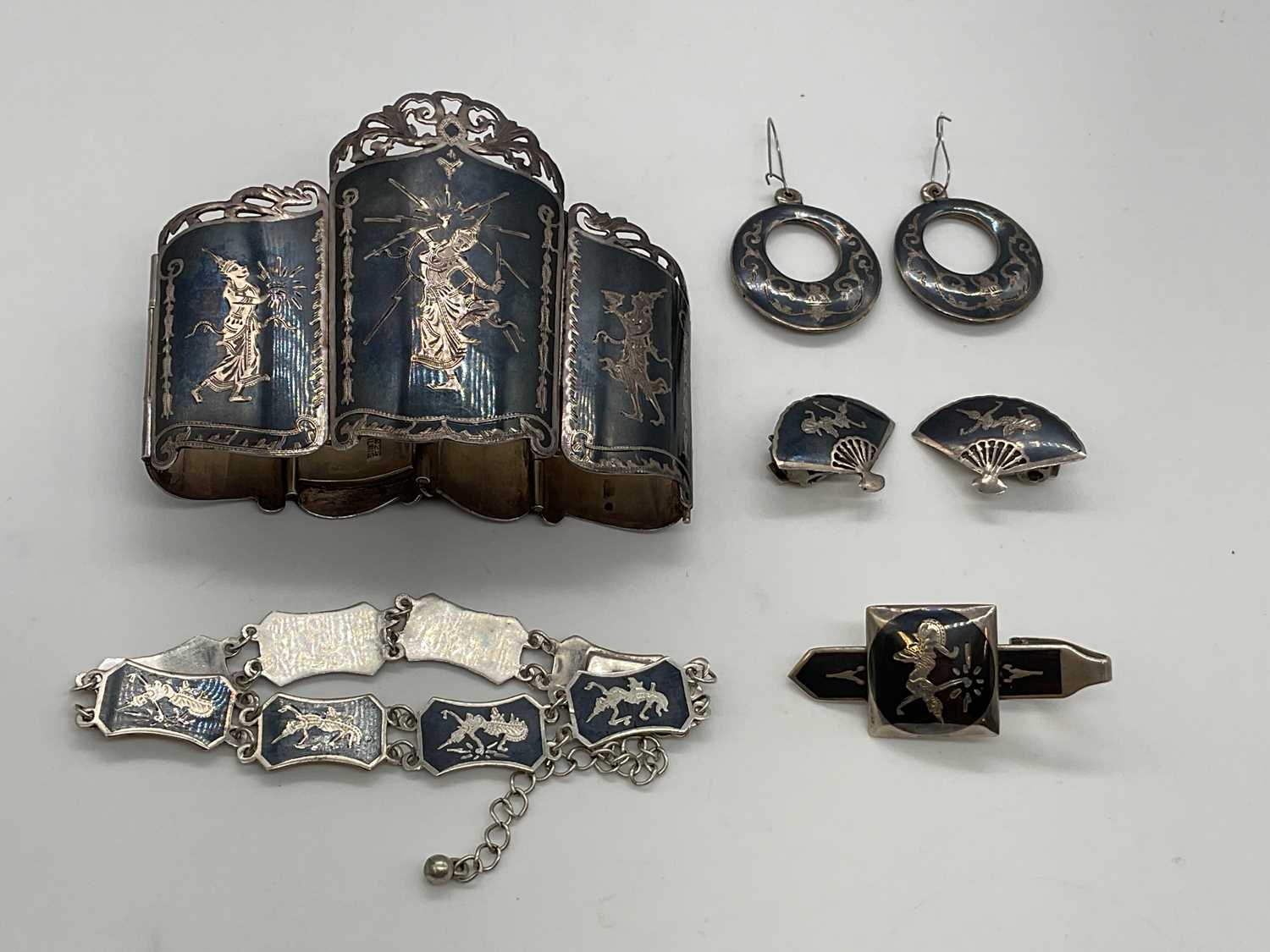 Lot 363 - A Siam sterling silver niello cuff bracelet, a...