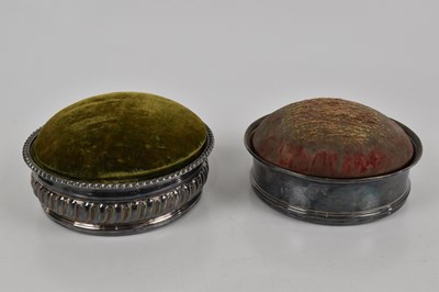 Lot 251 - Two silver plated bottle coasters, one...