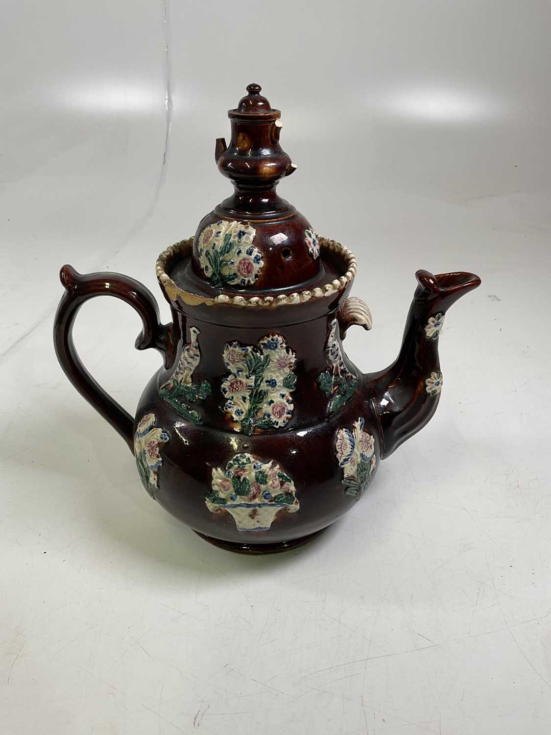 Lot 222 - A 19th centuty bargeware teapot and cover with...