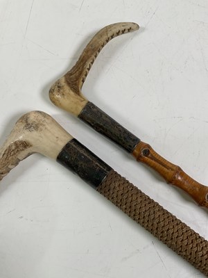 Lot 39 - Two horn handled and silver collared sticks,...