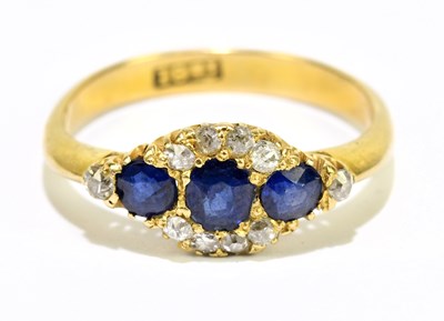 Lot 1197 - An 18ct yellow gold sapphire and diamond...
