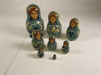 Lot 18 - A good set of eight Russian wooden dolls from...