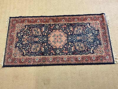 Lot 600 - A Persian rug, 178 x 90cm.