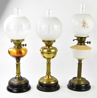 Lot 381 - Three early 20th century oil lamps including a...