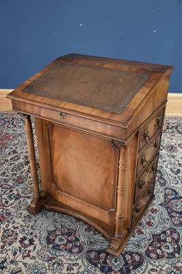 Lot 131 - A reproduction mahogany Davenport with tooled...