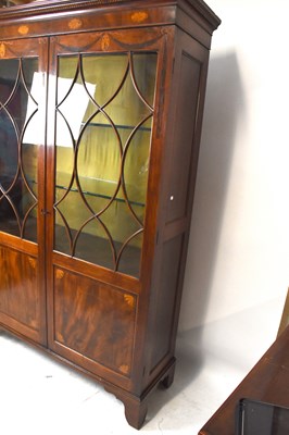 Lot 2720 - An Edwardian inlaid mahogany library bookcase,...