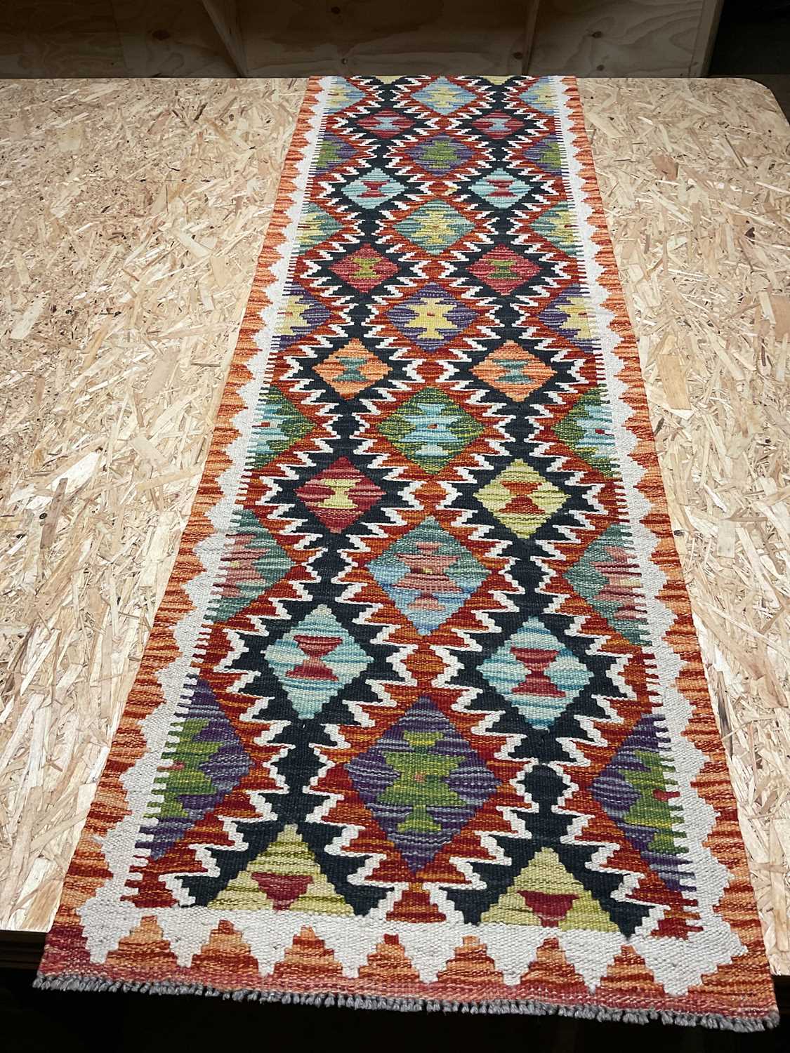 Lot 415 - A Chobi Kilim runner, 198 x 59cm.