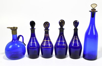 Lot 539 - Four Georgian Bristol Blue decanters, brandy,...