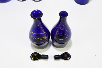 Lot 539 - Four Georgian Bristol Blue decanters, brandy,...