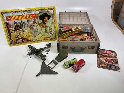 Lot 51 - A collection of vintage toys contained in a...