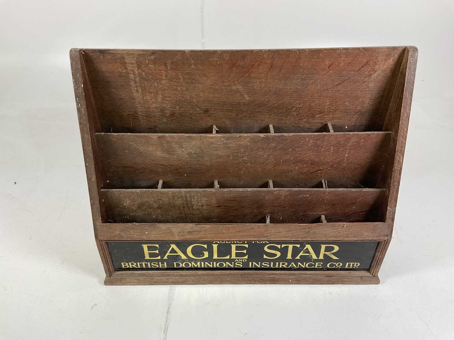 Lot 14 - A wooden document holder for Eagle Star and...