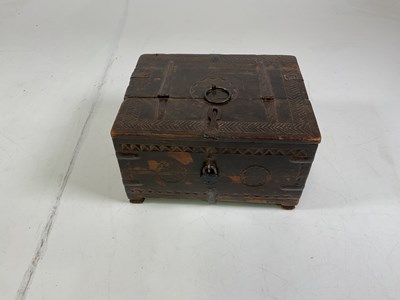 Lot 15 - A carved oak wooden safe box with metal hinges,...