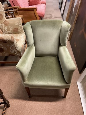 Lot 100 - A lady's Edwardian wing back chair on spade...