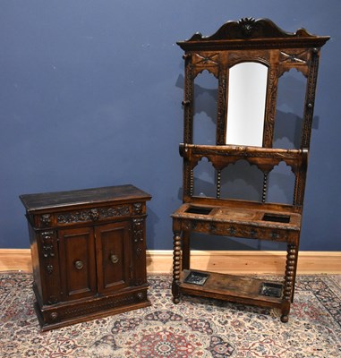 Lot 26 - A 1920s carved oak hall stand with mask head...