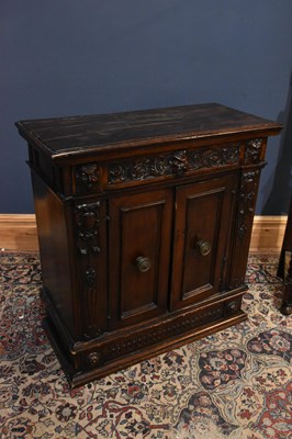 Lot 26 - A 1920s carved oak hall stand with mask head...