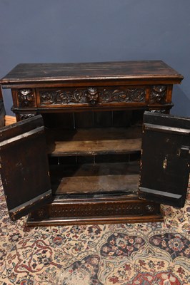 Lot 26 - A 1920s carved oak hall stand with mask head...