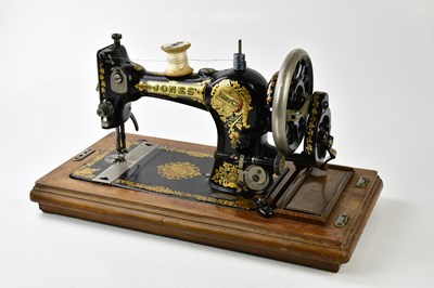 Lot 344 - JONES; a vintage manual sewing machine in case.