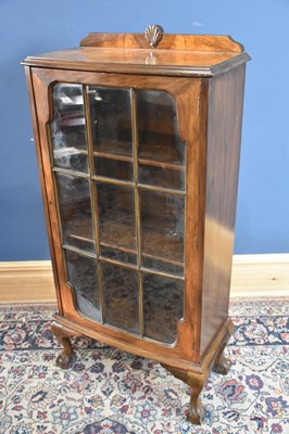 Lot 93 - A 1930s walnut display cabinet with glazed...