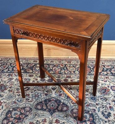 Lot 57 - An Edwardian mahogany fold-over swivel top...