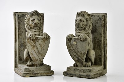 Lot 1050 - A pair of reproduction stone book ends...