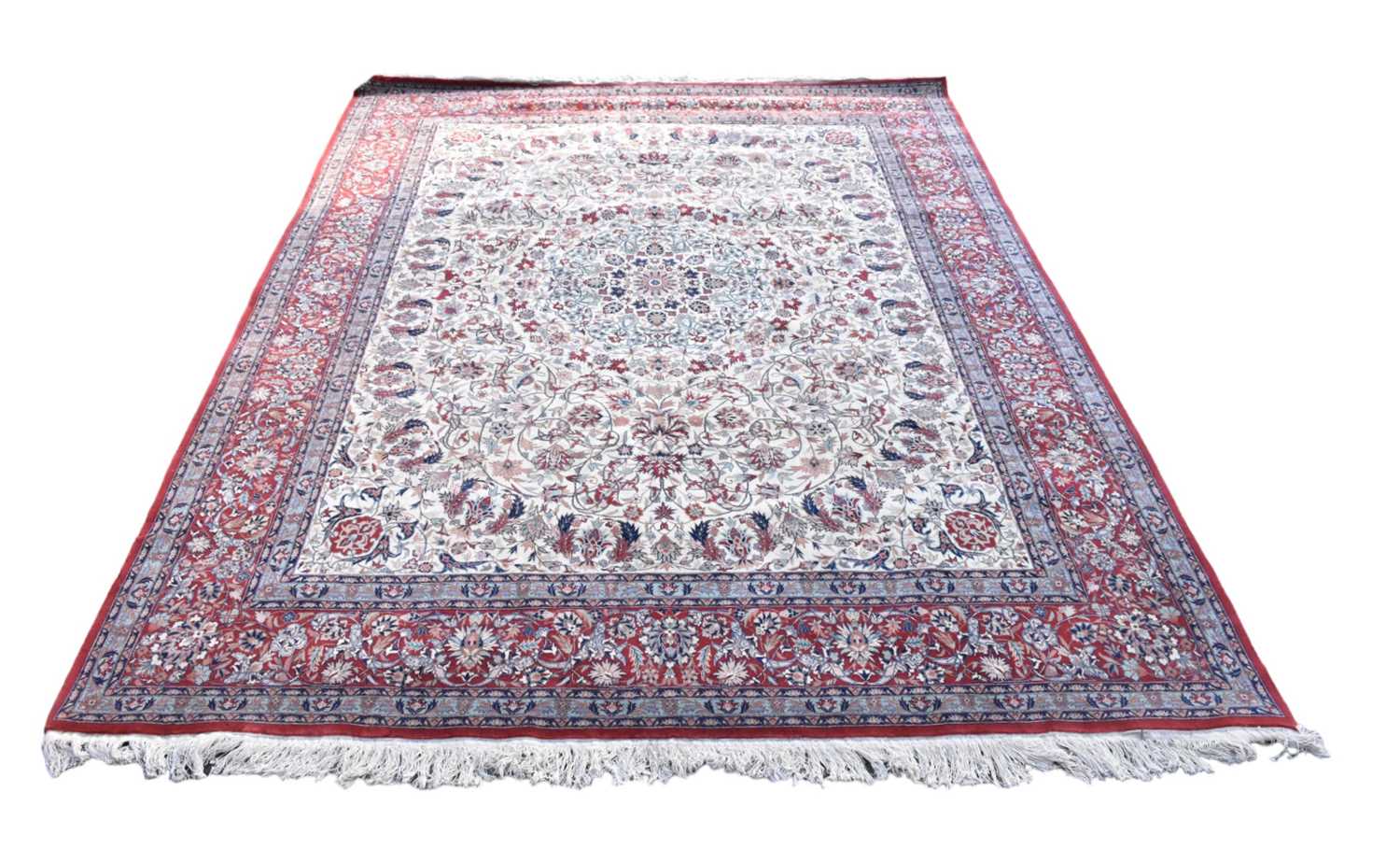 Lot 339 - A large part silk Eastern style rug, with