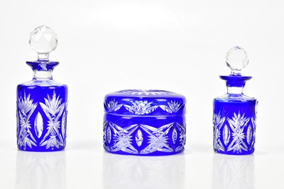 Lot 1496 - A three piece coloured cut glass dressing...