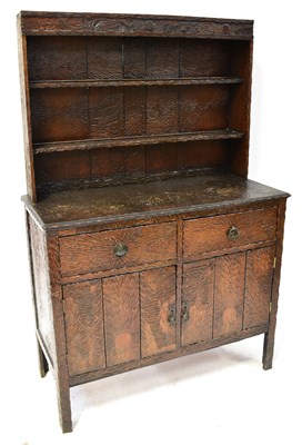 Lot 48 - An unusual early 20th century oak dresser with...